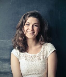 brown-haired-girl-in-white-sleeveless-dress-standing-beside-756453